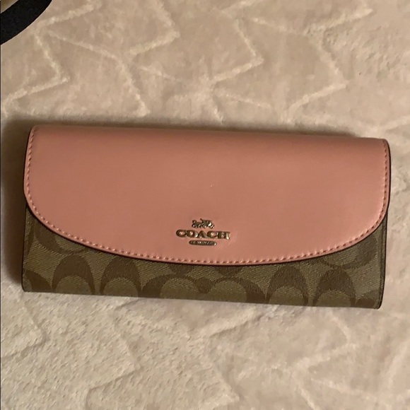 Coach Handbags - Coach envelope pvc pink